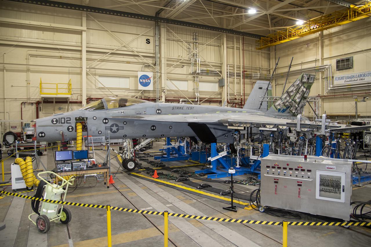 NASA’s Armstrong Flight Research Center Flight Loads Laboratory in Edwards, California, is working on one of its biggest load calibrations tests on an F/A-18E Super Hornet from the Naval Air Systems Command (NAVAIR) in Patuxent River, Maryland. This testing is needed before the aircraft can serve as a test vehicle for determining if it can safely manage maneuvers and proposed upgrades. This is a view of the test setup for the wing loads testing that is set to begin in December 2021.