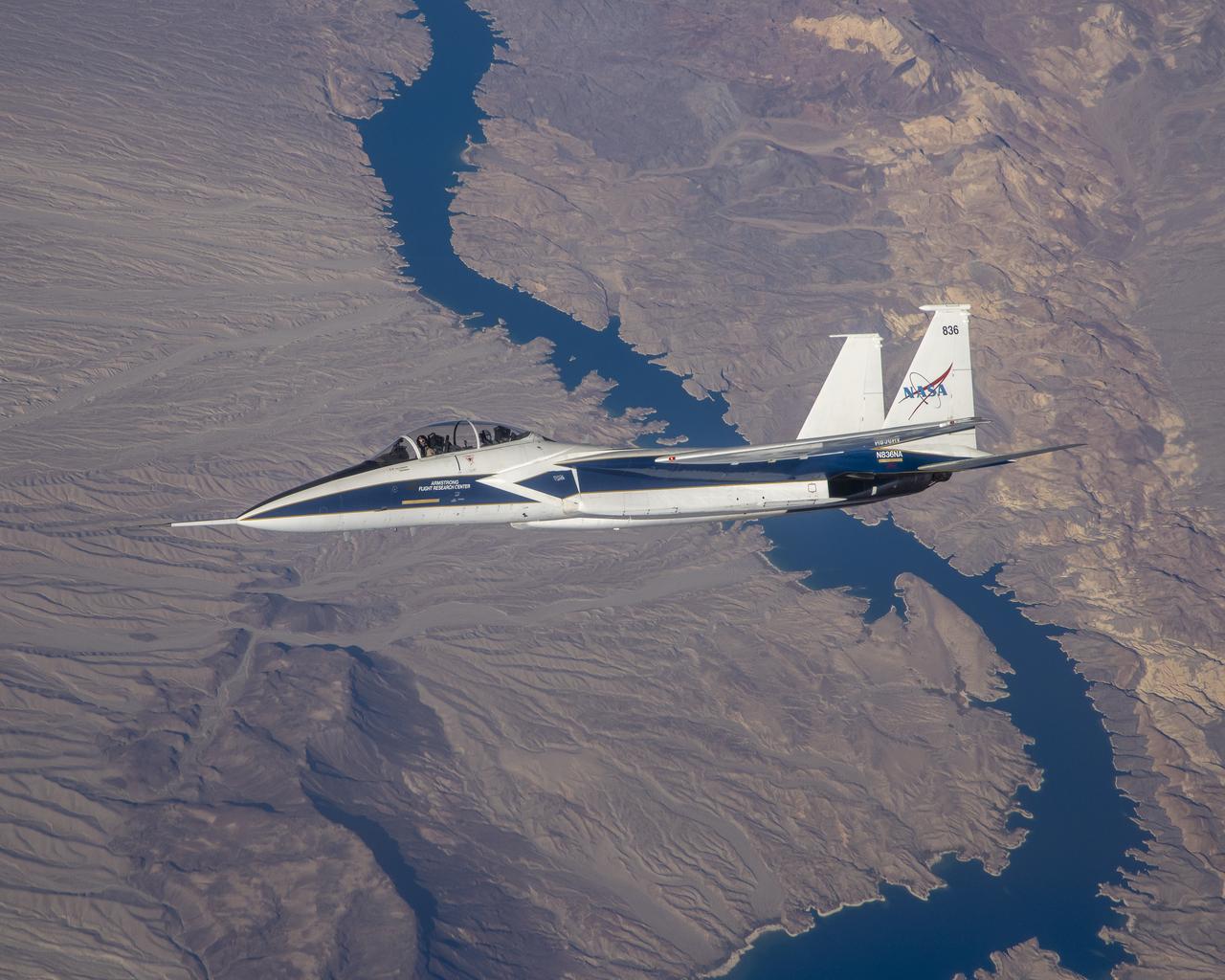 F-15 N836NA with test pilots Nils Larson and Jim Less at the controls flying over the Colorado River during Shock Sensing Probe (SSP) Flight #6.