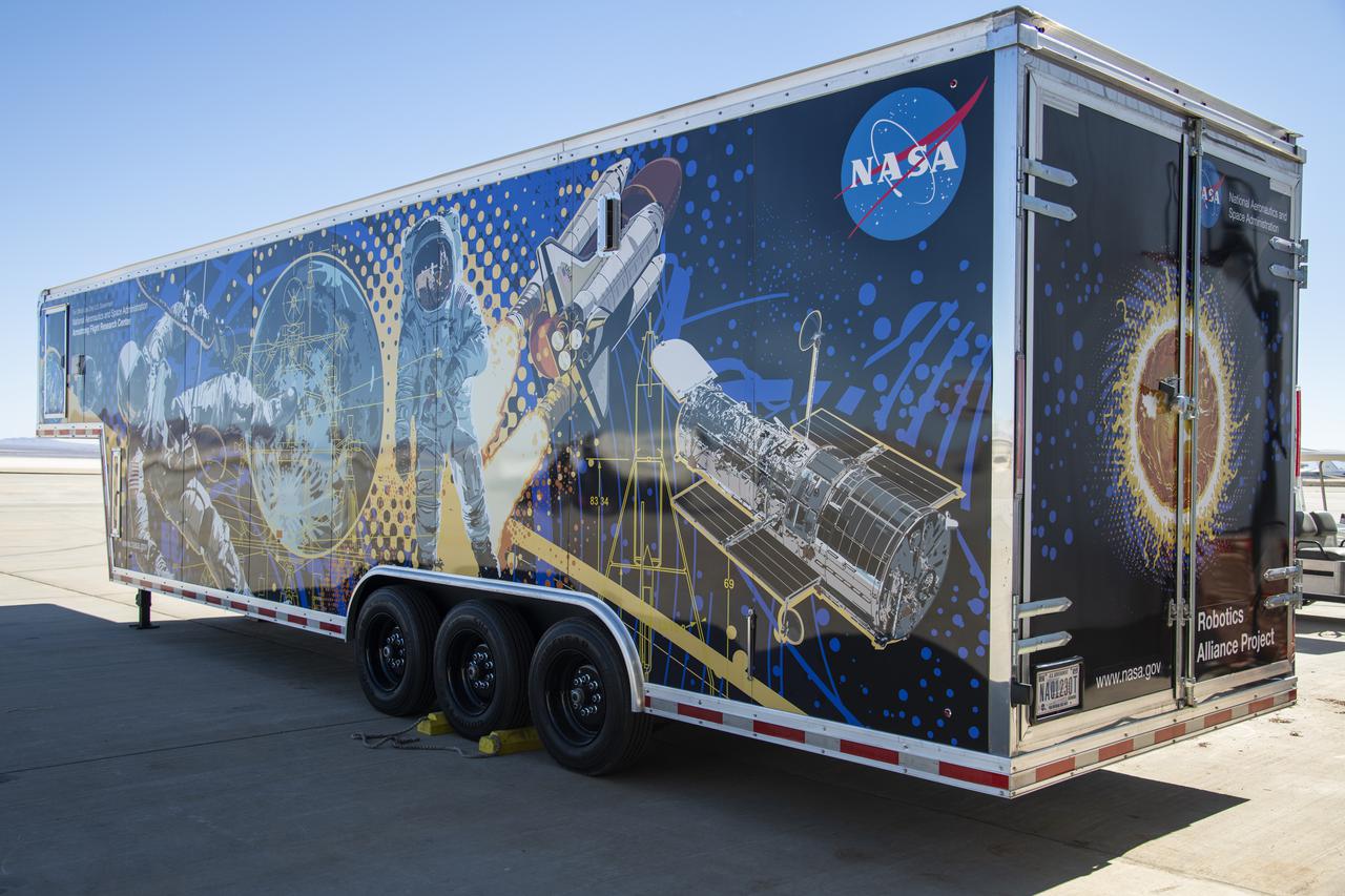 The Mobile Fabrication Shop was received at NASA Armstrong on February 7, 2022 as part of the Robotics Alliance Program based at NASA’s Johnson Space Center. This view shows the side and rear of the wrapped trailer that attends robotics competitions to help students during their robotics competitions.