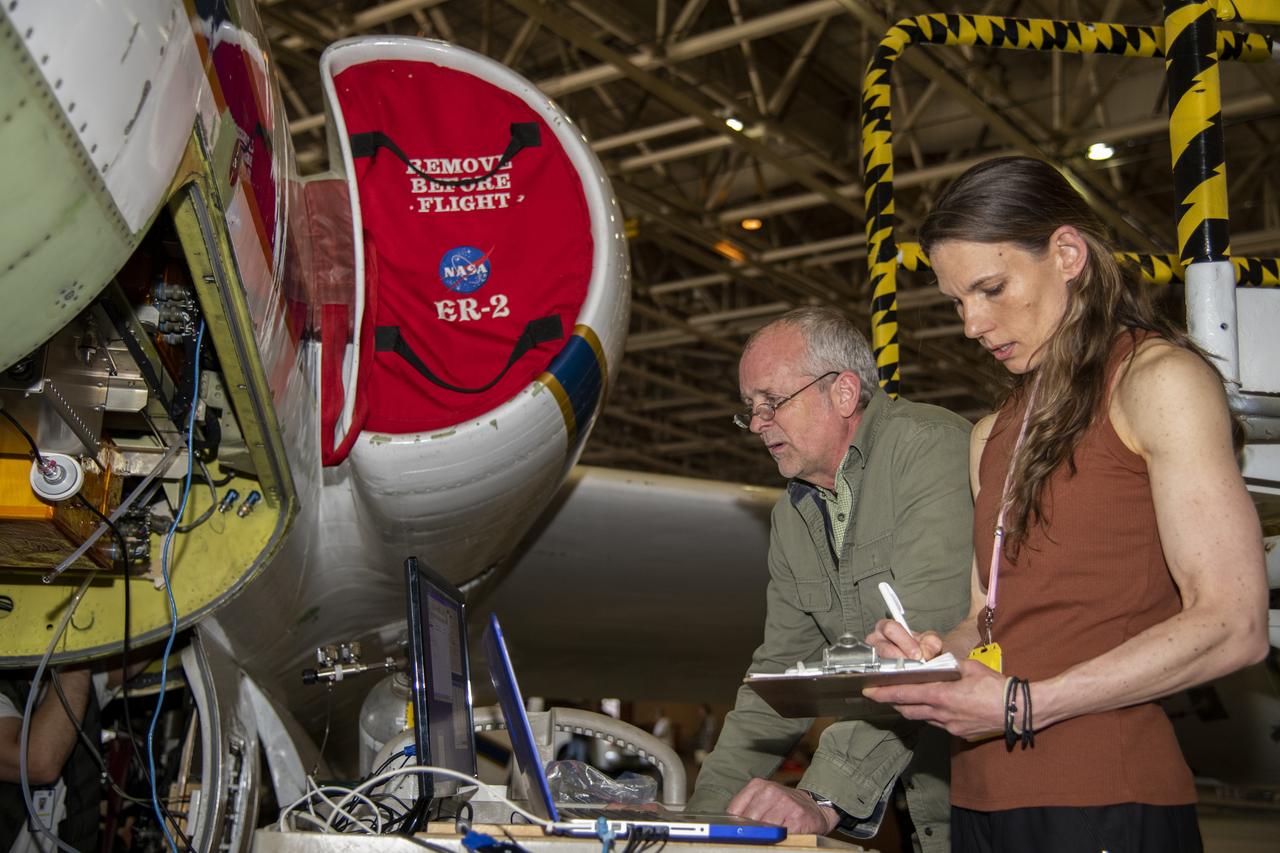 NASA's ER-2 aircraft is prepared for a check flight by Principal Investigator, Bruce Daube and co-principal investigator, Jasna Pitman, of the Harvard Picarro Cavity Ring Down Spectrometer (HUPCRS) instrument on May 13, 2022.