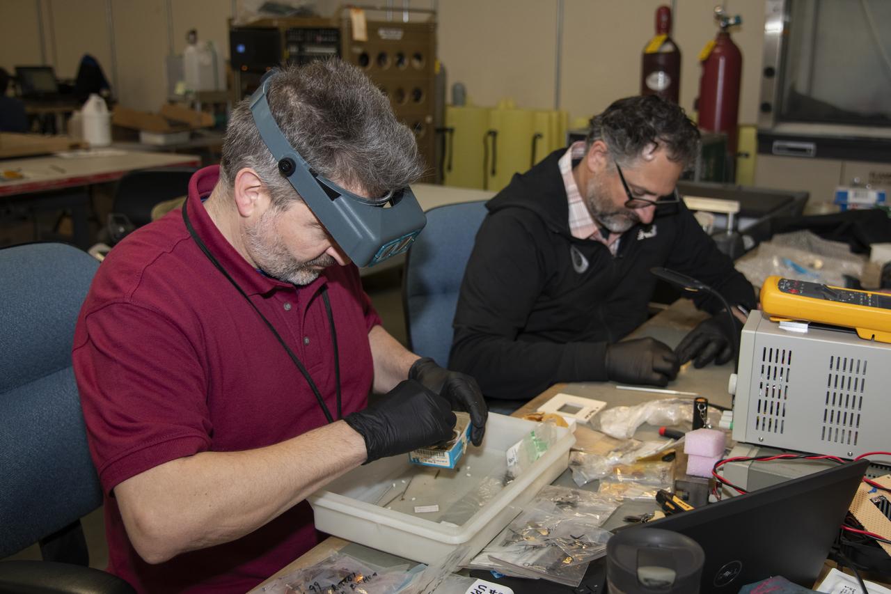 The Harvard Halogen Instrument (HAL) is prepared for integration on NASA's ER-2 by electrical engineer Marco Rivero and mechanical engineer Michael Greenberg for the Dynamics and Chemistry of the Summer Stratosphere, or DCOTSS, 2022 campaign.