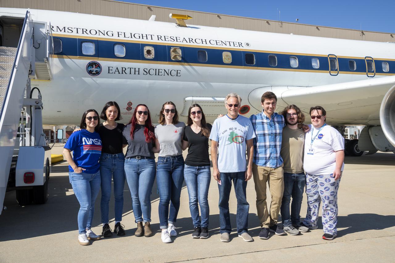 NASA Student Airborne Research Program participants pose in front of the DC-8 before their flight on Jun 23, 2022. The students are joined by mentors and professors to study air quality over the Central Valley in California. 