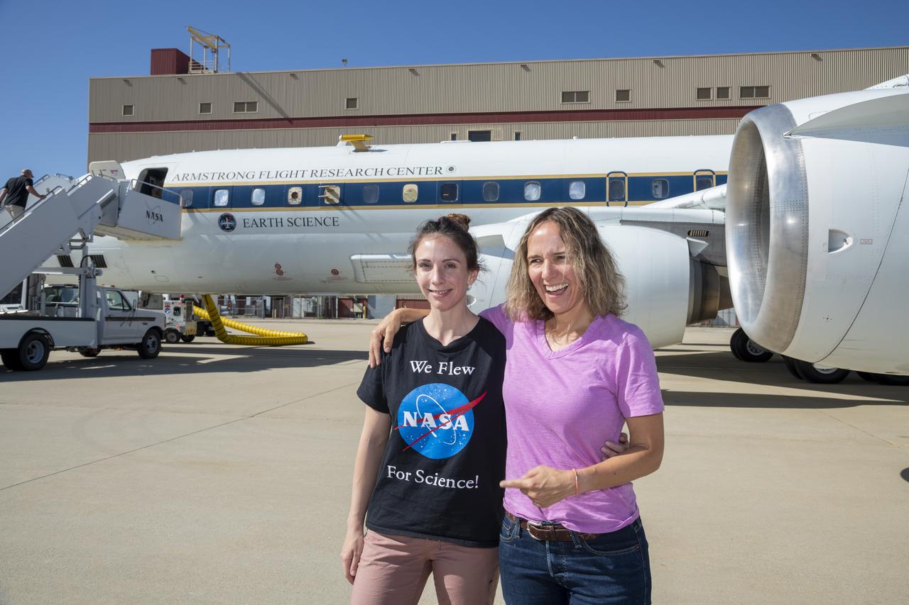 NASA Student Airborne Research Program Manager, Dr. Brenna Biggs and Professor of Chemistry at the University of California, Irvine and White House Office of Science and Technology Policy fellow, Dr. Ann Marie Carlton pose in front of the DC-8 on June 23, 2022.