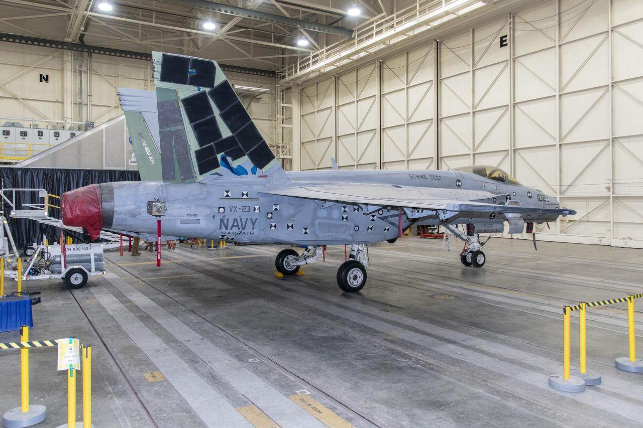 This left-side view shows an F/A-18E from the Naval Air Systems Command (NAVAIR) in Patuxent River, Maryland. The aircraft is in NASAâ€™s Armstrong Flight Research Center Flight Loads Laboratory in Edwards, California, where it underwent the centerâ€™s biggest load calibrations tests. This testing will permit the aircraft to serve as a test vehicle to determine if it can safely manage maneuvers and proposed upgrades.