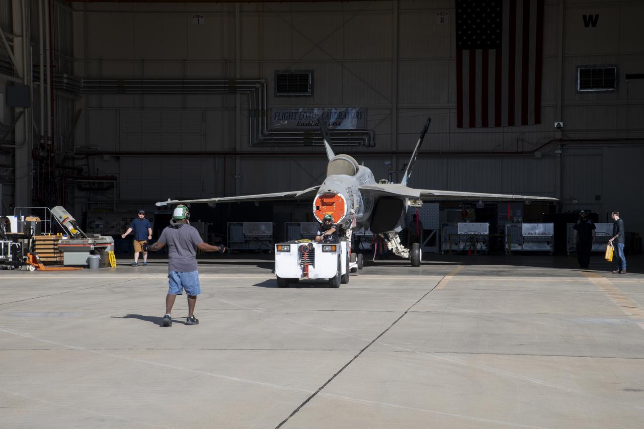 An F/A-18E from the Naval Air Systems Command (NAVAIR) in Patuxent River, Maryland, is moved from NASAâ€™s Armstrong Flight Research Center Flight Loads Laboratory in Edwards, California, to a hangar where it will undergo final preparations to return to its squadron. The aircraft underwent the centerâ€™s biggest load calibrations tests. The testing will permit the aircraft to serve as a test vehicle to determine if it can safely manage maneuvers and proposed upgrades.
