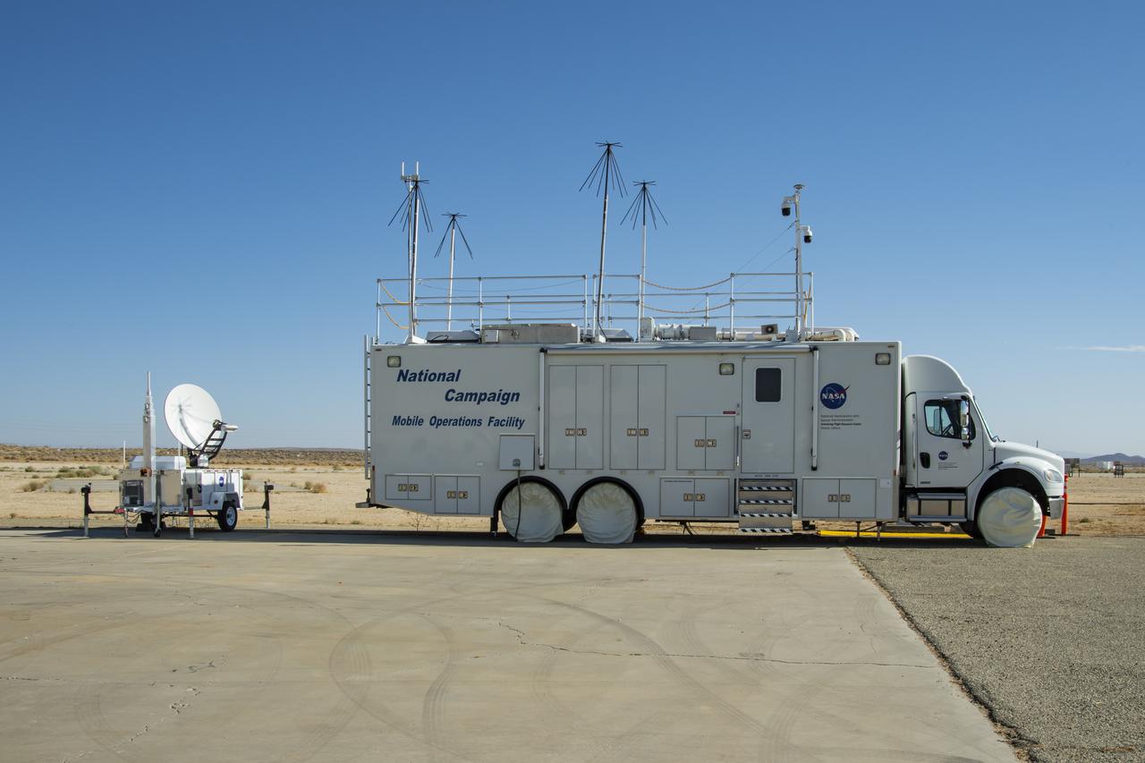 The NASA Mobile Operations Facility sports new decals while parked at NASA Armstrong Flight Research Center in Edwards, California on July 20, 2022. This vehicle, also known as the MOF, is a mission control and data collection center on wheels. NASA's Advanced Air Mobility project uses it for testing. 