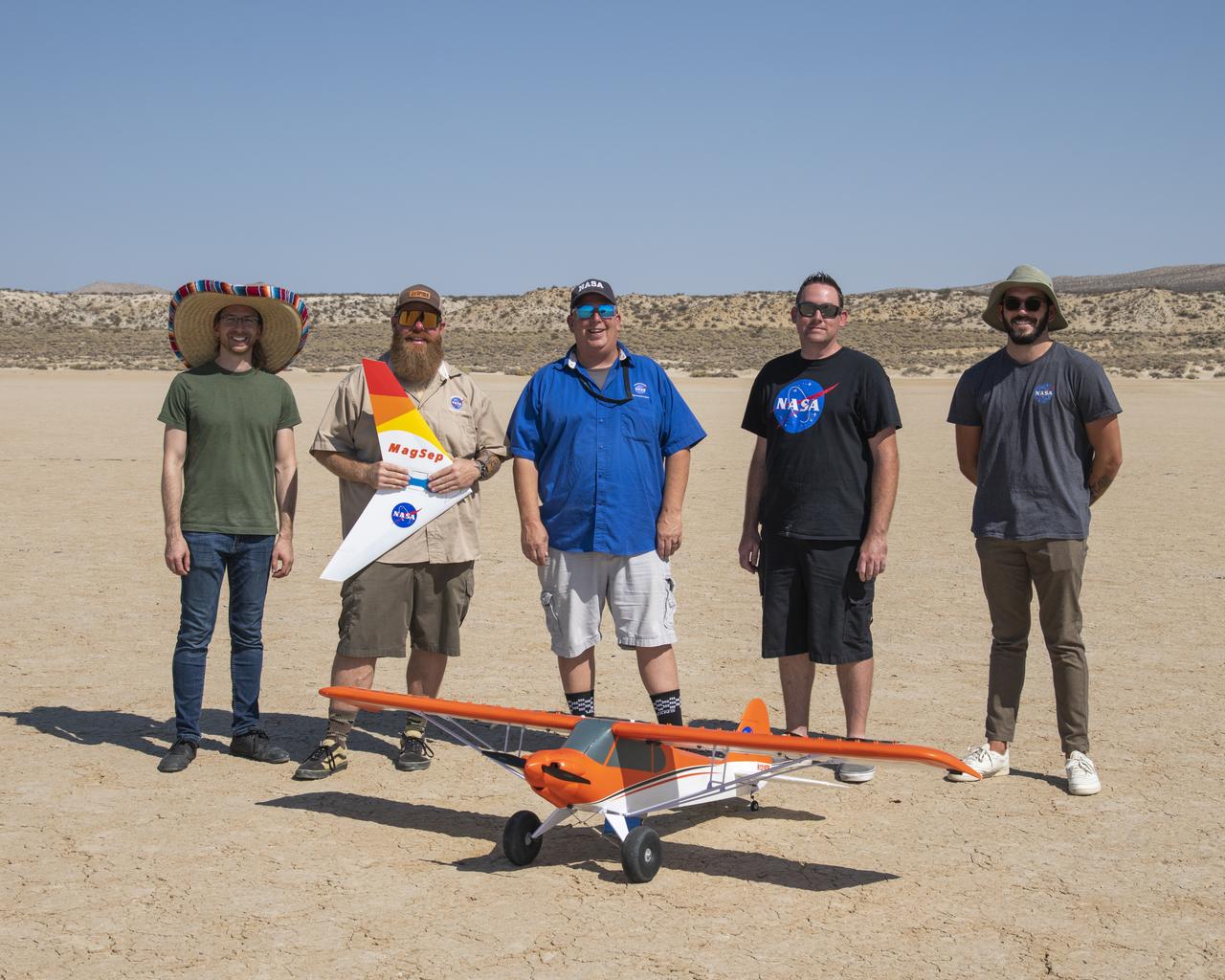 A Preliminary Research Aerodynamic Design to Land on Mars, or Prandtl-M, glider was air launched Sept. 7 using a magnetic release mechanism mounted on a Carbon-Z Cub. The team, based at NASA's Armstrong Flight Research Center in Edwards, California, includes, from left, Paul Bean, Justin Hall, Red Jensen, Justin Link, and Nathan Allaire.