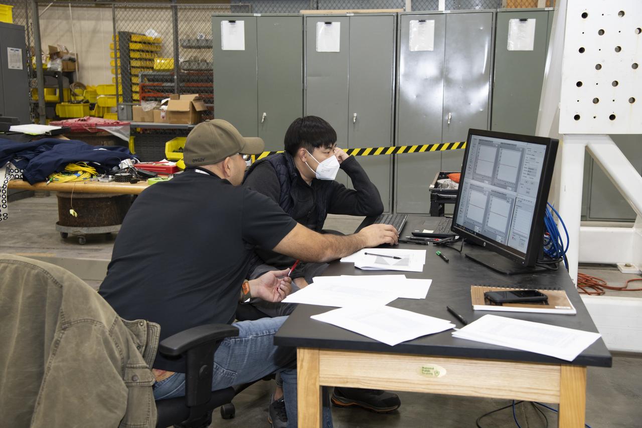 Frank Pena and Benjamin Park watch as data streams in from tests on a 6-foot model of the Transonic Truss-Braced Wing at NASA’s Armstrong Flight Research Center, in Edwards, California.