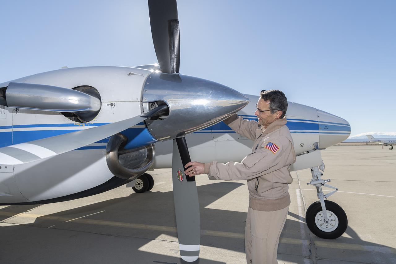 NASA’s Armstrong Flight Research Center in Edwards, California, flew the B200 King Air in support of the Signals of Opportunity Synthetic Aperture Radar (SoOpSAR) campaign. Prior to deploying the plane, NASA research pilot Jeff Borton provides ground checks of the aircraft on Feb. 27, 2023.