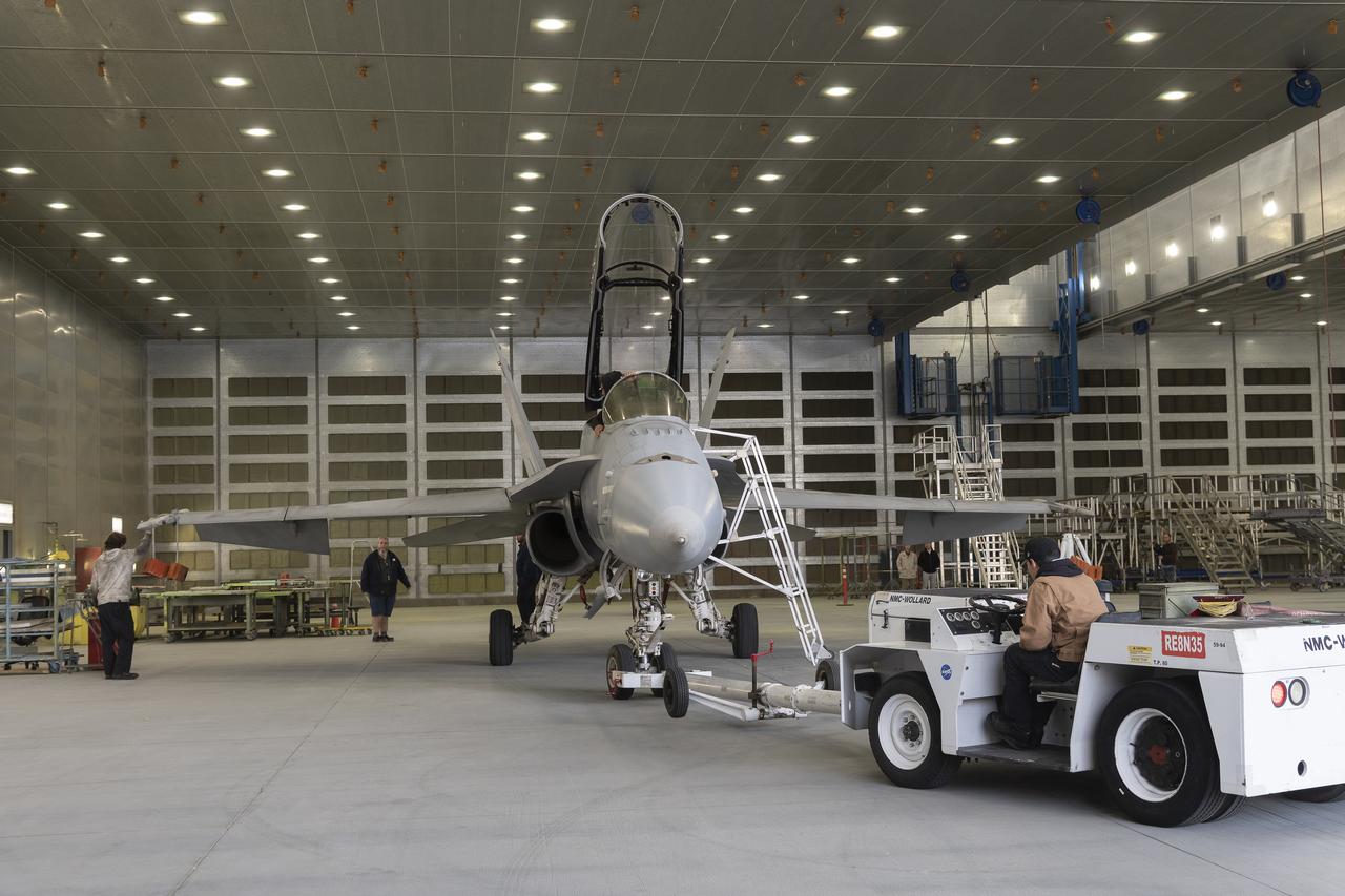 NASA 862, which is an F/A-18D based at NASA’s Armstrong Flight Research Center in Edwards, California, is positioned in the U.S. Air Force Corrosion Control Facility. The facility is also known as the Paint Barn. 