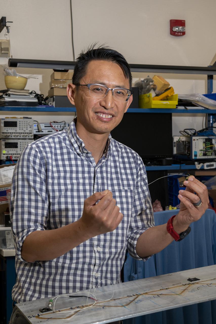 NASA’s Armstrong Flight Research Center’s FOSS, Fiber Optic Sensing System, recently supported tests of a system designed to turn oxygen into liquid oxygen, a component of rocket fuel. Patrick Chan, electronics engineer, and NASA Armstrong’s FOSS portfolio project manager, shows fiber like that used in the testing.
