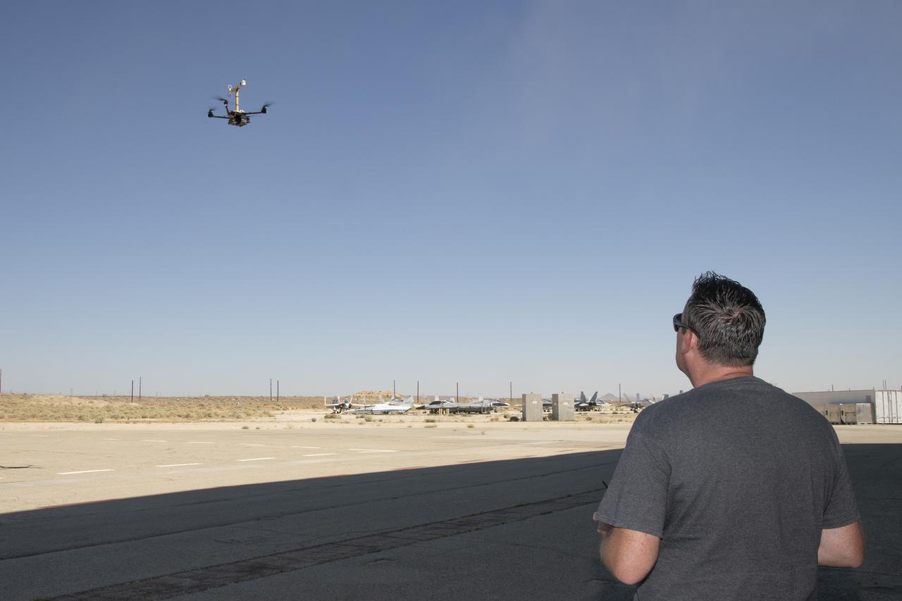 Justin Link positions the Alta-X aircraft for a hover to capture data as part of the Advanced Exploration of Reliable Operation at Low Altitudes: Meteorology, Simulation and Technology campaign. The campaign was at NASA Armstrong to study wind from the ground to 2,000 feet to provide data to assist future drones to safely land on rooftop hubs called vertiports and to potentially improve weather prediction.
