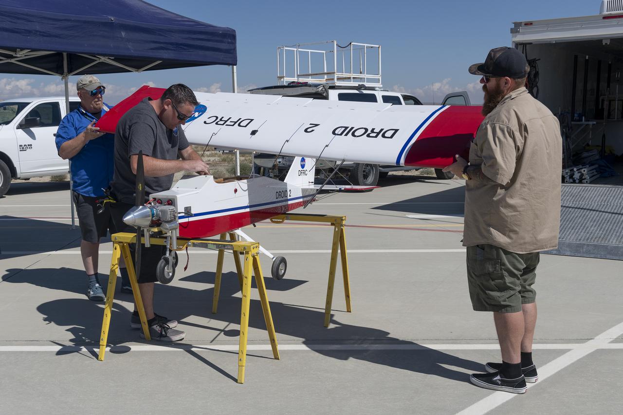 Robert "Red" Jensen, Justin Link, and Justin Hall prepare the DROID 2 (Dryden Remotely Operated Integrated Drone 2) for the Advanced Exploration of Reliable Operation at Low Altitudes: Meteorology, Simulation, and Technology campaign flights. The weather study was at NASA's Armstrong Flight Research Center in Edwards, California. The focus was to study wind to provide data for safe takeoff and landing of future air taxis.