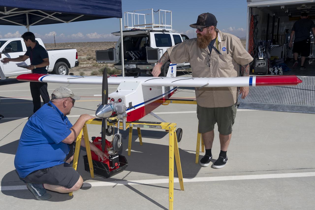 Robert "Red" Jensen and Justin Hall prepare the DROID 2 (Dryden Remotely Operated Integrated Drone 2) aircraft for the Advanced Exploration of Reliable Operation at Low Altitudes: Meteorology, Simulation, and Technology campaign flights. The weather study was at NASA's Armstrong Flight Research Center in Edwards, California. The focus was to study wind to provide data for safe takeoff and landing of future air taxis.