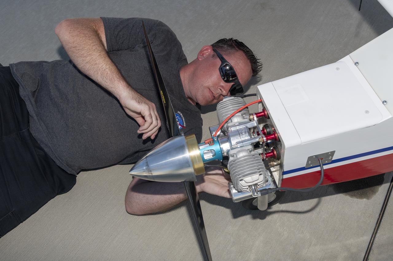 Justin Link prepares the DROID 2 (Dryden Remotely Operated Integrated Drone 2) aircraft before a flight for the Advanced Exploration of Reliable Operation at Low Altitudes: Meteorology, Simulation, and Technology campaign. The weather study was at NASA's Armstrong Flight Research Center in Edwards, California. The focus was to study wind to provide data for safe takeoff and landing of future air taxis.