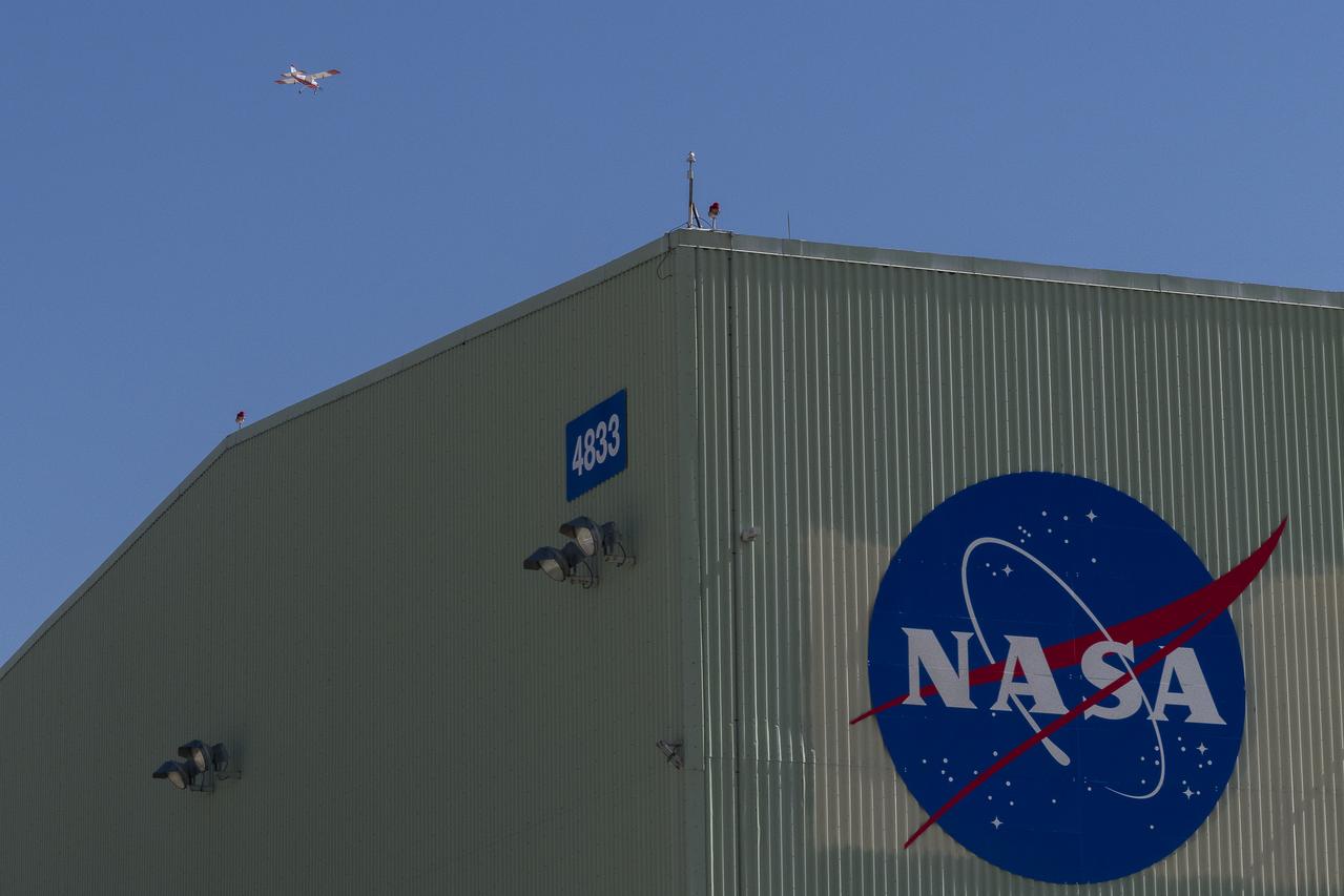 The DROID 2 (Dryden Remotely Operated Integrated Drone 2) aircraft flies by the former space shuttle hangar at NASA's Armstrong Flight Research Center in Edwards, California, as part of the Advanced Exploration of Reliable Operation at Low Altitudes: Meteorology, Simulation, and Technology campaign. The focus was to study wind to provide data for safe takeoff and landing of future air taxis.