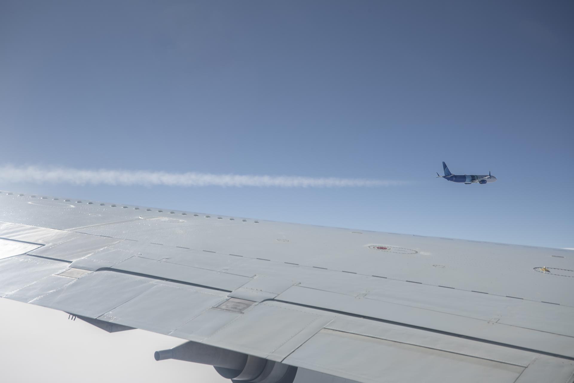 DC-8 aircraft conduct research in flight of condensation trails.