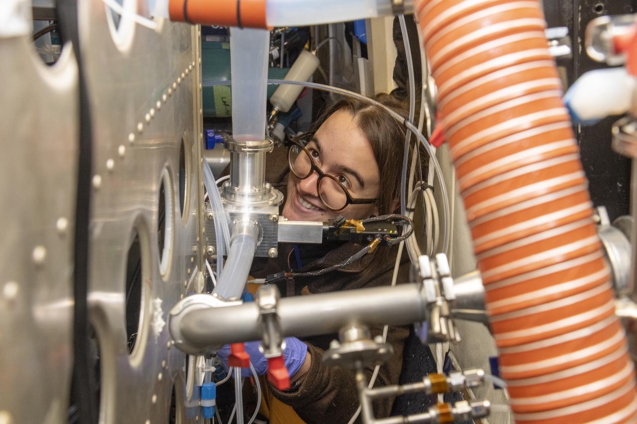 Kat Ball, Chemical Engineering Ph.D candidate at Caltech, attends to the Chemical Ionization Mass Spectrometer (CIMS) rack onboard the DC-8 aircraft at Building 703 in Palmdale, CA. The DC-8 aircraft is prepared for its last mission, ASIA-AQ (Airborne and Satellite Investigation of Asian Air Quality), that will collect detailed air quality data over several locations in Asia to improve the understanding of local air quality in collaboration with local scientists, air quality agencies, and government partners
