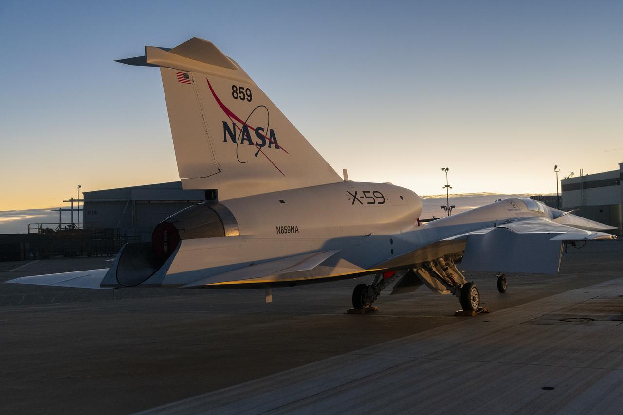 NASA’s X-59 quiet supersonic research aircraft sits on the ramp at Lockheed Martin Skunk Works in Palmdale, California during sunrise, shortly after completion of painting. With its unique design, including a 38-foot-long nose, the X-59 was built to demonstrate the ability to fly supersonic, or faster than the speed of sound, while reducing the typically loud sonic boom produced by aircraft at such speeds to a quieter sonic “thump”. The X-59 is the centerpiece of NASA’s Quesst mission, which seeks to solve one of the major barriers to supersonic flight over land, currently banned in the United States, by making sonic booms quieter. 
