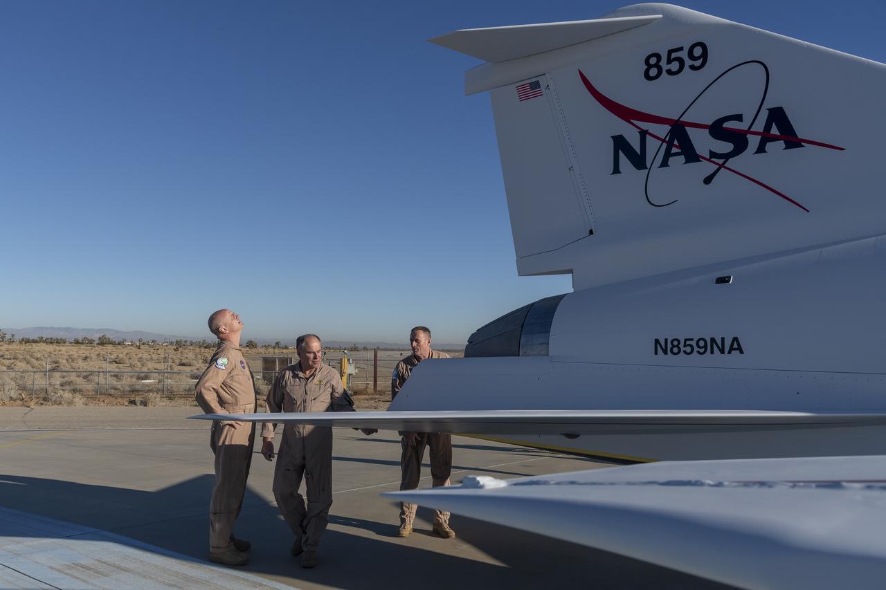 NASA and Lockheed Martin test pilots inspect the painted X-59 as it sits on the ramp at Lockheed Martin Skunk Works in Palmdale, California. The X-59 is the centerpiece of NASA’s Quesst mission, which seeks to solve one of the major barriers to supersonic flight over land, currently banned in the United States, by making sonic booms quieter.