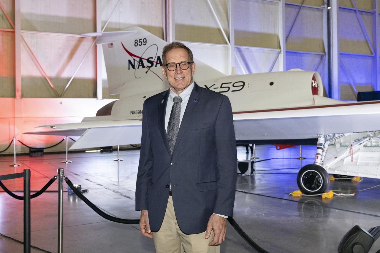 NASA’s mission integration manager for the Quesst mission, Peter Coen, poses in front of the agency’s X-59 quiet supersonic research aircraft at a January 12, 2024 event at Lockheed Martin Skunk Works in Palmdale, California. The X-59 is the centerpiece of NASA’s Quesst mission, which seeks to solve one of the major barriers to supersonic flight over land, currently banned in the United States, by making sonic booms quieter.