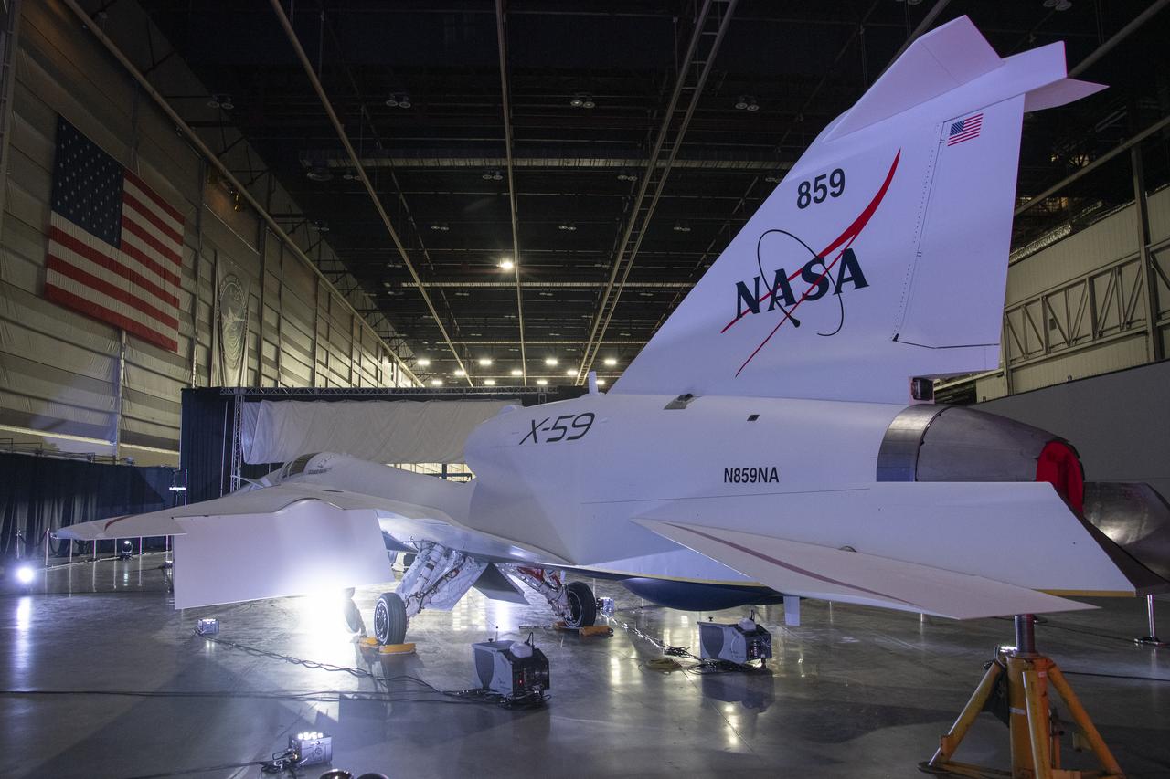 NASA’s X-59 quiet supersonic research aircraft sits in position inside a hangar at Lockheed Martin Skunk Works in Palmdale, California prior to its January 12, 2024 unveiling. The X-59 is the centerpiece of NASA’s Quesst mission, which seeks to solve one of the major barriers to supersonic flight over land, currently banned in the United States, by making sonic booms quieter.