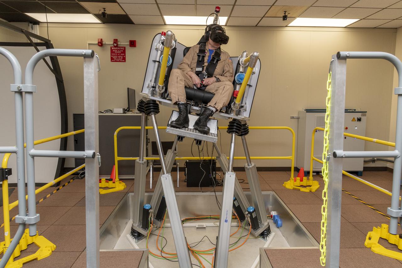 NASA test pilot Wayne Ringelberg sits in the air taxi virtual reality flight simulator during a test at NASA’s Armstrong Flight Research Center in Edwards, California in March 2024.