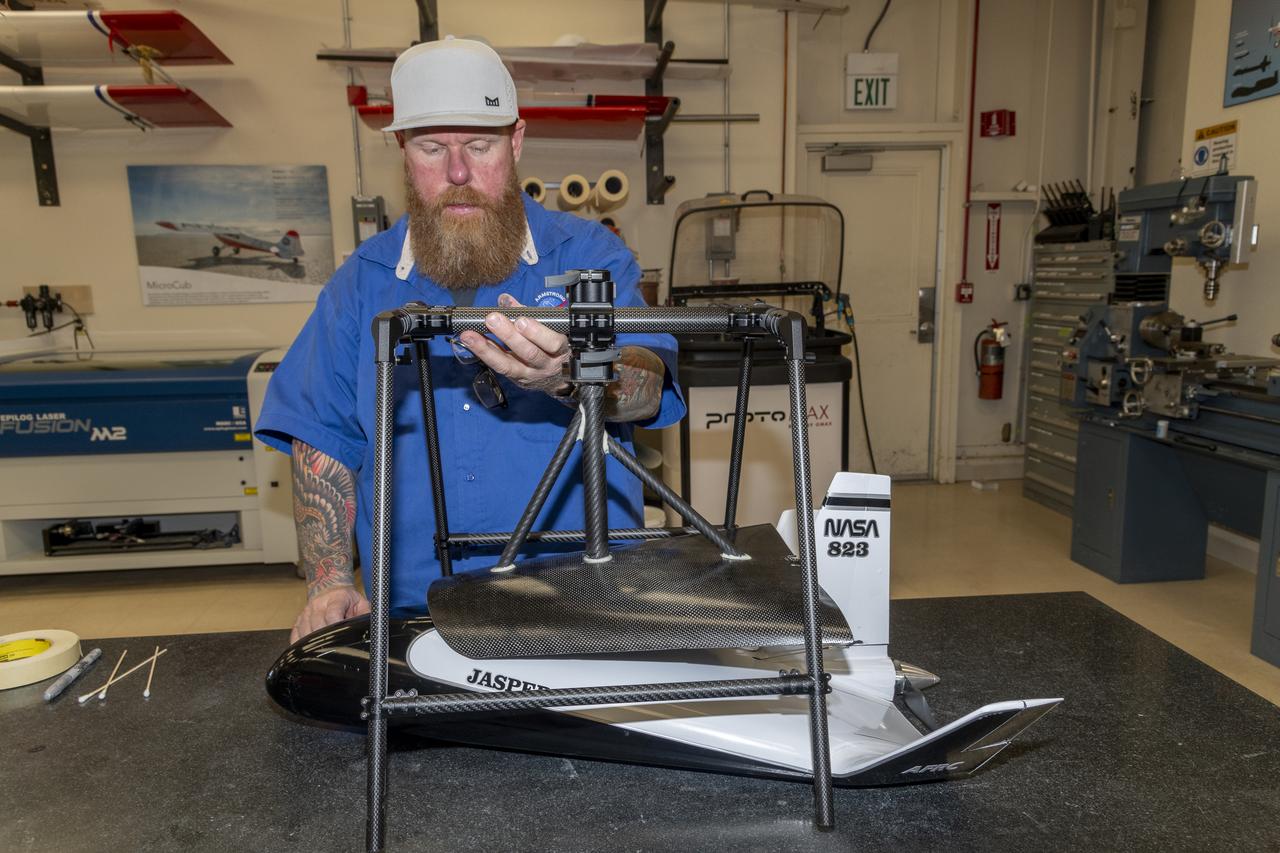 Justin Hall assembles parts of a cradle for a rotorcraft that will air launch a proposed atmospheric probe in summer 2024 at NASA’s Armstrong Flight Research Center in Edwards, California. Hall is a designer, technician, and pilot at the center’s Dale Reed Subscale Flight Research Laboratory.