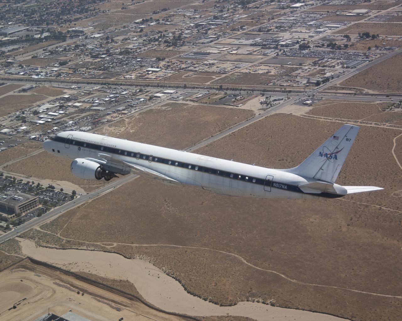 The DC-8 flies low over the Antelope Valley during its final flight before it is retired from NASA’s Armstrong Flight Research Center Building 703 in Palmdale, California, to Idaho State University in Pocatello, Idaho. The DC-8 will provide real-world experience to train future aircraft technicians at the college’s Aircraft Maintenance Technology Program.