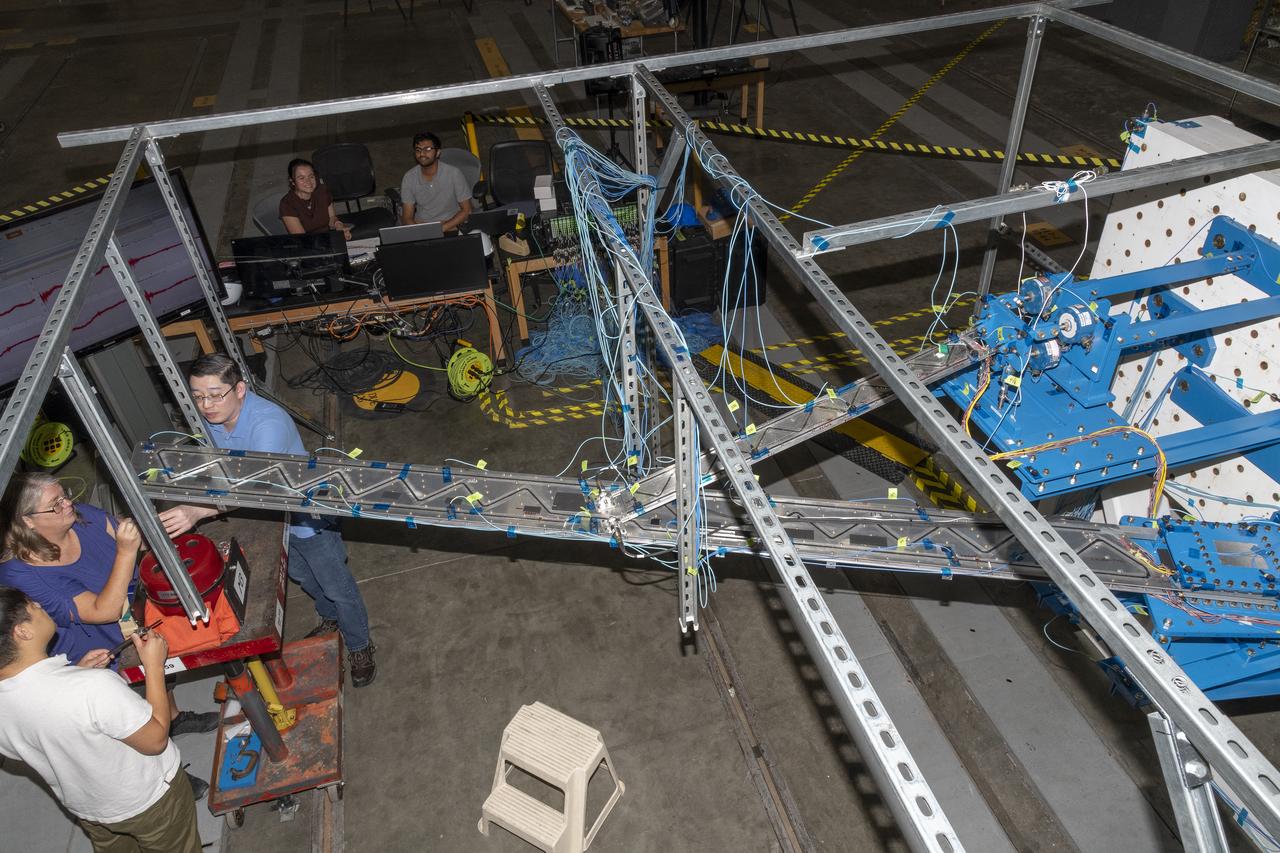 Researchers test a 10-foot Mock Truss-Braced Wing at NASA’s Armstrong Flight Research Center in Edwards, California. A view from above shows the test structure, the wing, and the strut. The aircraft concept involves a wing braced on an aircraft using diagonal struts that also add lift and could result in significantly improved aerodynamics.