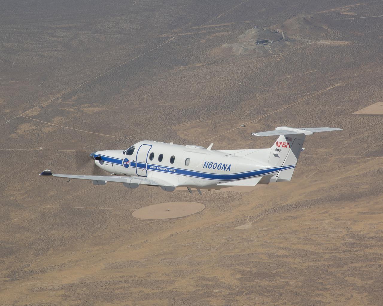 Equipped with state-of-the-art technology to test and evaluate communication, navigation, and surveillance systems, NASA’s Pilatus PC-12 flies over the Mojave Desert near Armstrong Flight Research Center in Edwards, California. Based at Glenn Research Center in Cleveland, the Pilatus PC-12 runs a series of familiarization flights for NASA Armstrong pilots before a test series evaluating ADS-B or Automatic Dependent Surveillance Broadcast systems for advanced air mobility applications in the desert flight test range on Sept. 18, 2024. Airborne work during familiarization flights includes several approach and landings, with an emphasis on avionics, then medium altitude air-work with steep turns, slow flight, and stall demonstrations to qualitatively understand the handling characteristics of the aircraft. The flights lasted about 60 to 90 minutes on average.