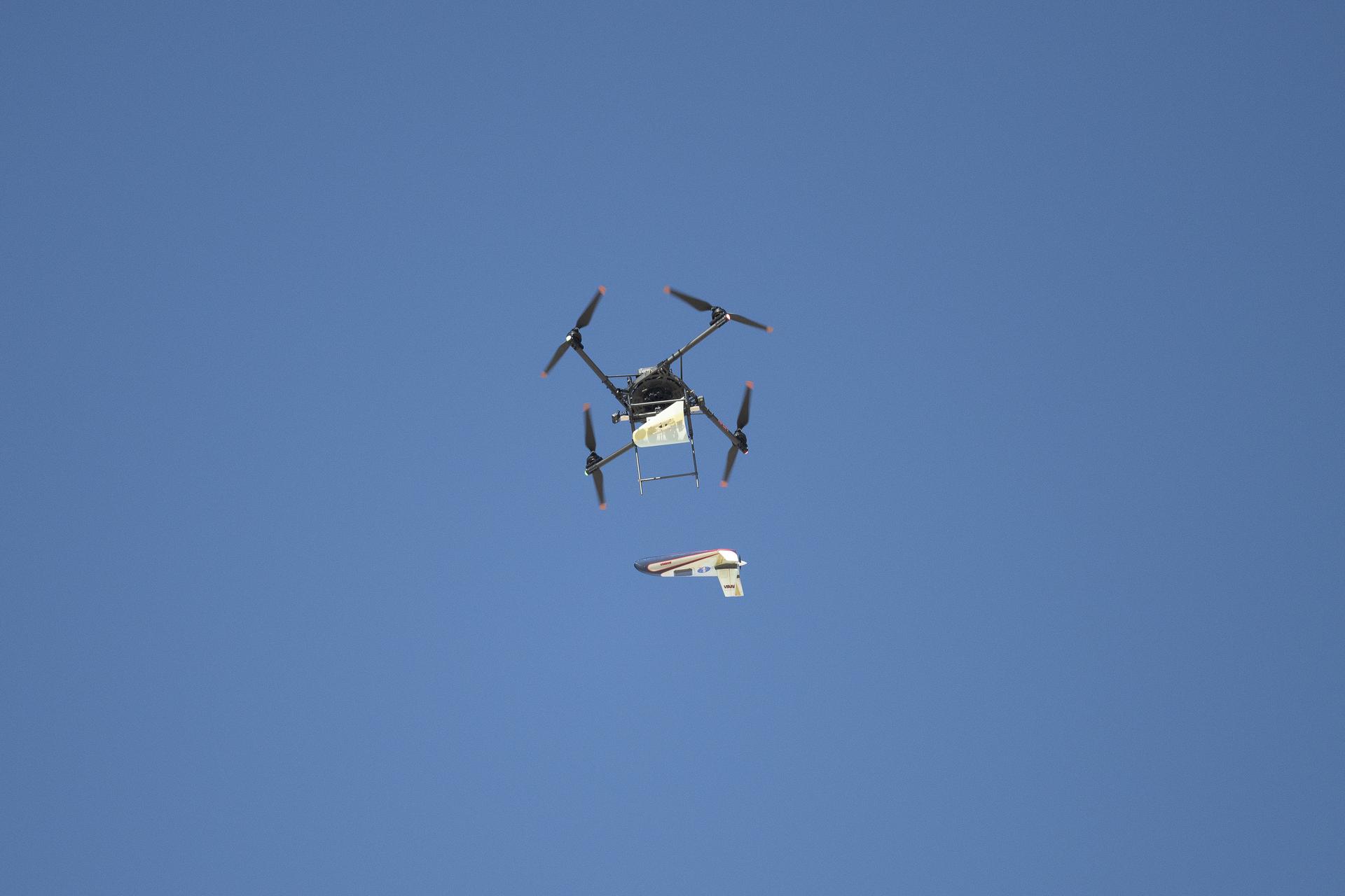 A quad rotor remotely piloted aircraft releases an atmospheric probe model in flight.