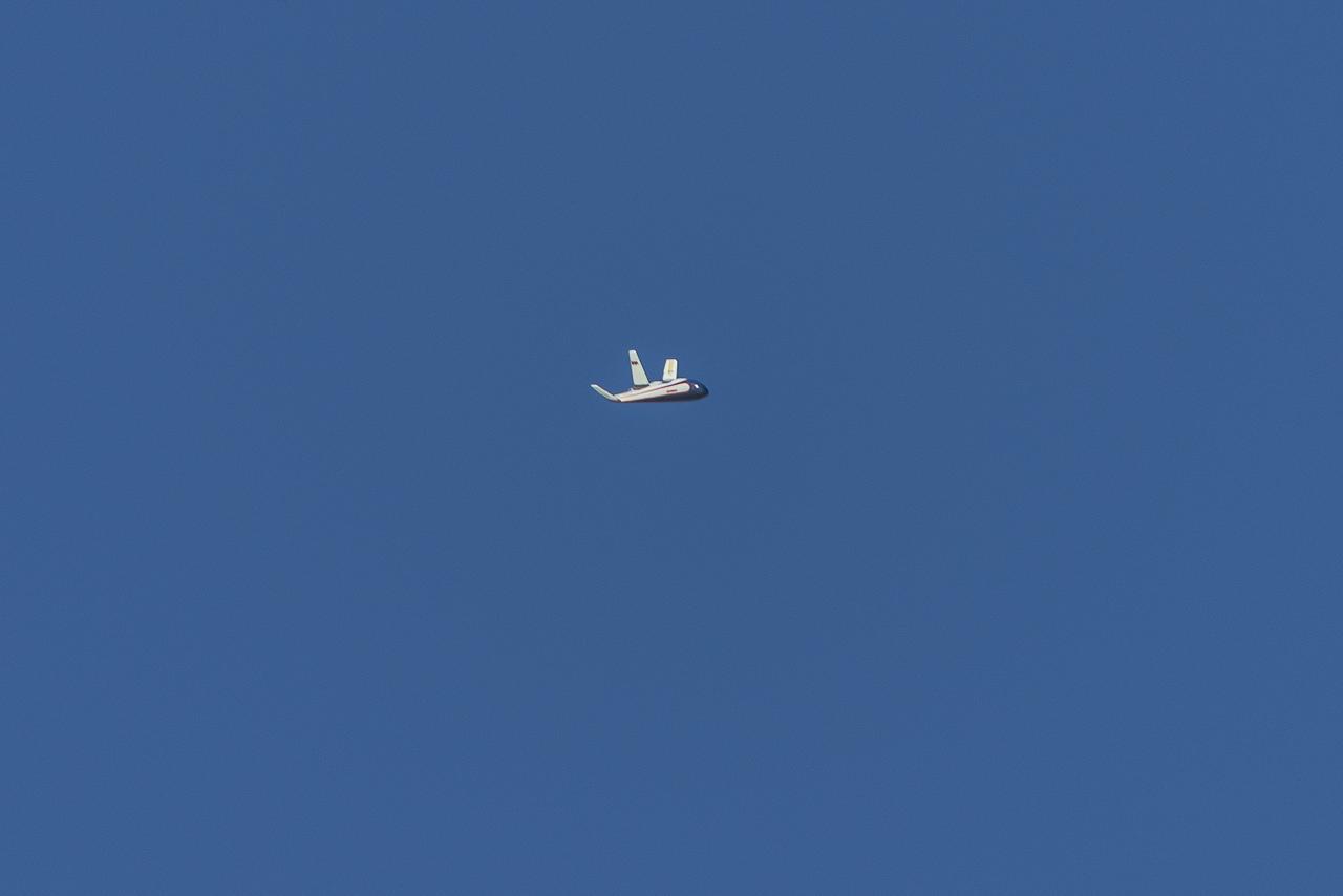 The atmospheric probe model flies free after release from a quad rotor remotely piloted aircraft above Rogers Dry Lake, a flight area adjacent NASA’s Armstrong Flight Research Center in Edwards, California, on Oct. 22, 2024. The probe was designed and built at the center.