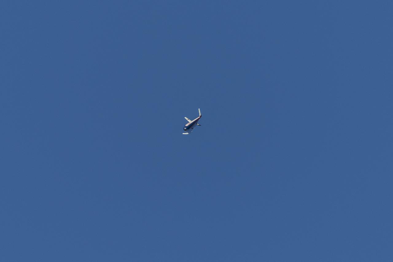 The atmospheric probe model flies free after release from a quad rotor remotely piloted aircraft above Rogers Dry Lake, a flight area adjacent NASA’s Armstrong Flight Research Center in Edwards, California, on Oct. 22, 2024. The probe was designed and built at the center.