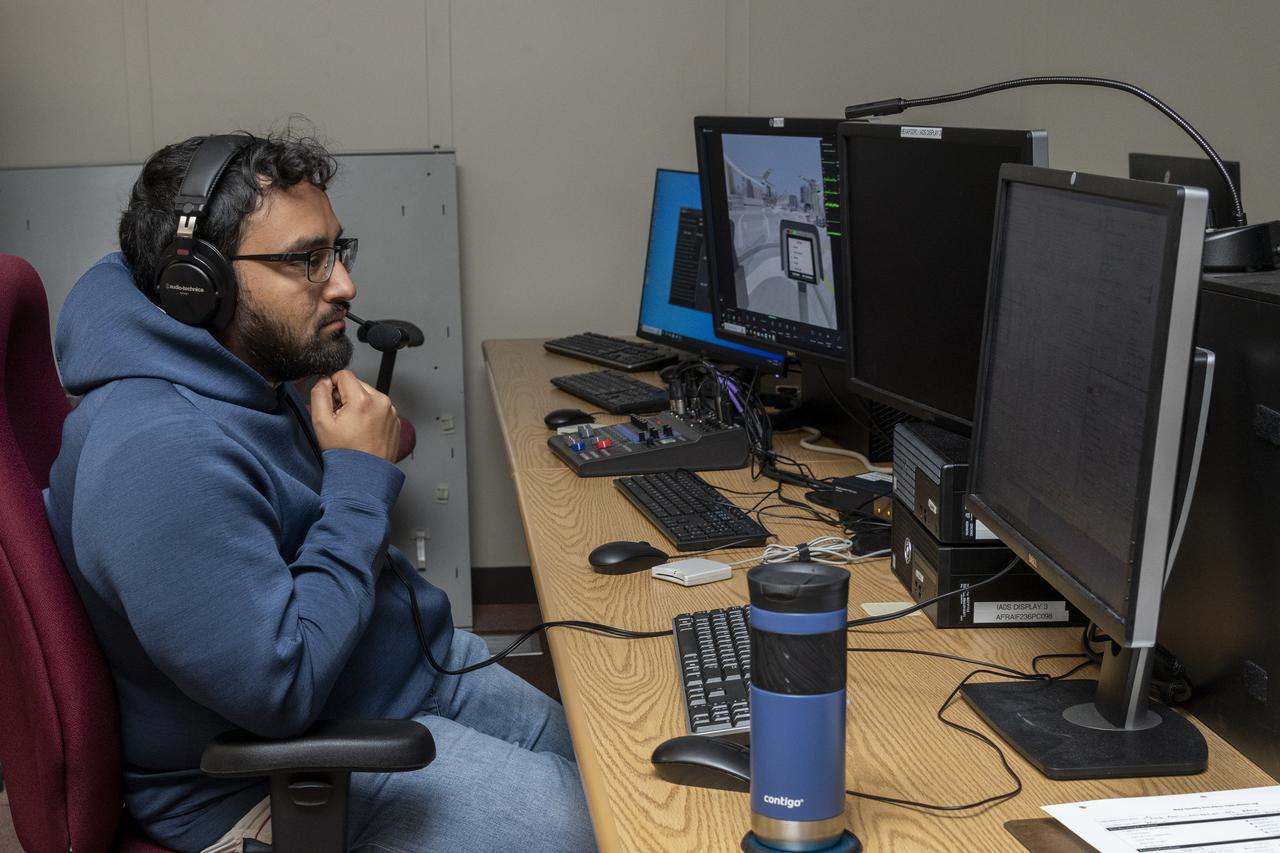 NASA researcher Saravanakumaar Ramia controls the air taxi passenger ride quality simulator by monitoring several computers in the Ride Quality Laboratory at NASA’s Armstrong Flight Research Center in Edwards, California, during an experiment on Oct. 23, 2024. Studies continue in this lab to better understand passenger comfort for future air taxi rides.