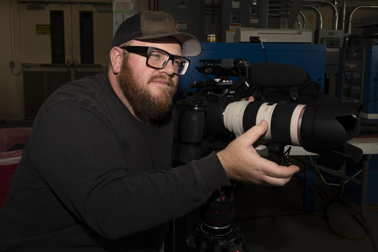 NASA videographer Jacob Shaw captures footage of the ER-2 aircraft inside a hangar at NASA’s Armstrong Flight Research Center in Edwards, California, in December 2024. Shaw recently earned first place in NASA’s 2024 Videographer of the Year Awards – documentation category – for his film, “Reflections,” which chronicles the 2024 Airborne Science mission PACE-PAX – short for Plankton, Aerosol, Cloud, ocean Ecosystem Postlaunch Airborne eXperiment.