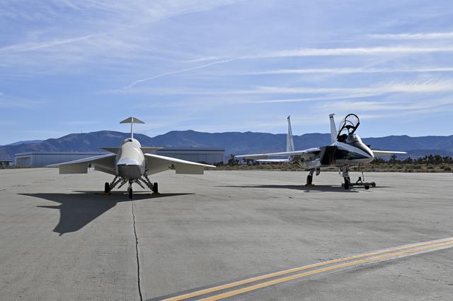 NASA image: NASA’s F-15D research aircraft is positioned adjacent to the X-59 during electromagnetic compatibility testing at U.S. Air Force Plant 42 in Palmdale, California. Researchers activated the F-15D’s radar, C-band transponder, and radios at different dist
