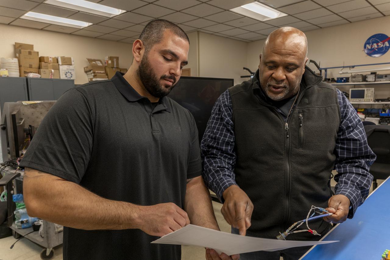 Jonathan Lopez and Allen Parker confer on the hypersonic Fiber Optic Sensor System at NASA’s Armstrong Flight Research Center in Edwards, California, on February 13, 2025. The system measures strain and temperature, critical safety data for hypersonic vehicles that travel five time the speed of sound.