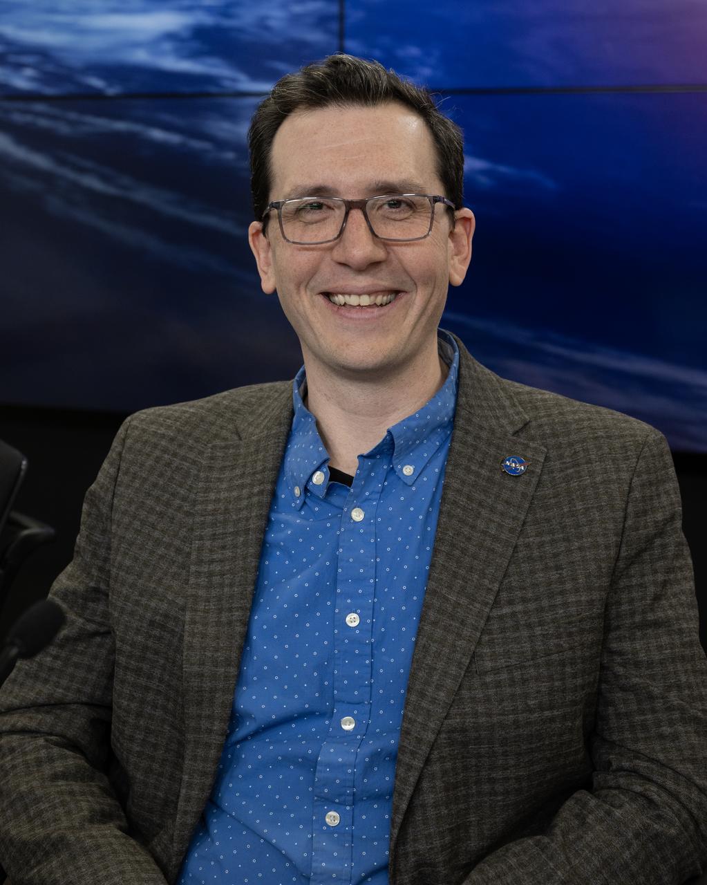 Shawn Domagal-Goldman, acting director, Astrophysics Division, NASA Headquarters, participates in a science briefing on Tuesday, Feb. 25, 2025, to discuss the upcoming launch of NASA’s SPHEREx (Spectro-Photometer for the History of the Universe, Epoch of Reionization and Ices Explorer) observatory and PUNCH (Polarimeter to Unify the Corona and Heliosphere) satellites at Vandenberg Space Force Base in California. SPHEREx will use its telescope to provide an all-sky spectral survey, creating a 3D map of the entire sky to help scientists investigate the origins of our universe. PUNCH will study origins of the Sun’s outflow of material, or the solar wind, capturing continuous 3D images of the Sun’s corona and the solar wind’s journey into the solar system. 