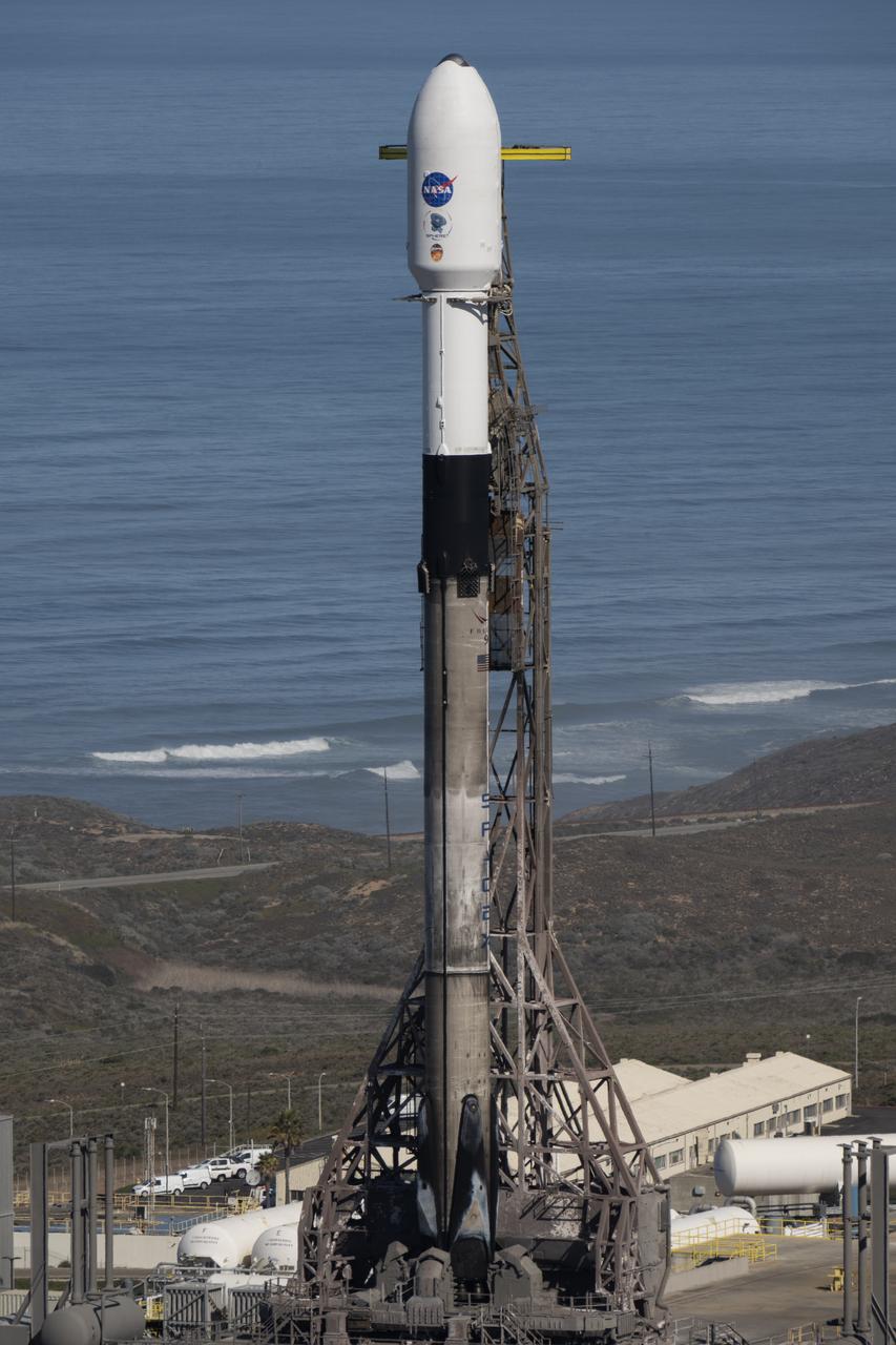 A SpaceX Falcon 9 rocket, carrying NASA’s SPHEREx (Spectro-Photometer for the History of the Universe, Epoch of Reionization and Ices Explorer) observatory and PUNCH (Polarimeter to Unify the Corona and Heliosphere) satellites, is vertical at Space Launch Complex 4 East from Vandenberg Space Force Base in California on Saturday, March 8,  2025. SPHEREx will use its telescope to provide an all-sky spectral survey, creating a 3D map of the entire sky to help scientists investigate the origins of our universe. PUNCH will study origins of the Sun’s outflow of material, or the solar wind, capturing continuous 3D images of the Sun’s corona and the solar wind’s journey into the solar system. 