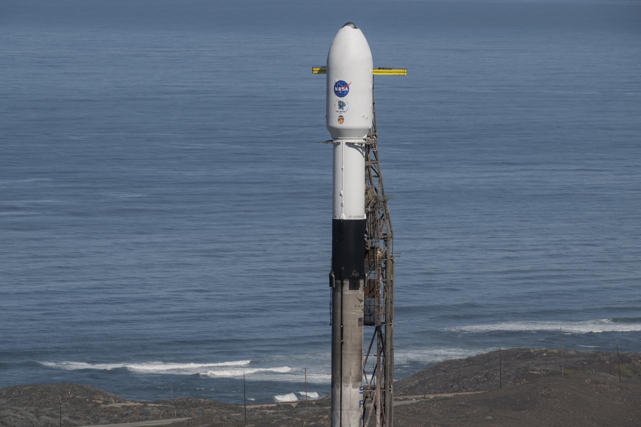 A SpaceX Falcon 9 rocket, carrying NASA’s SPHEREx (Spectro-Photometer for the History of the Universe, Epoch of Reionization and Ices Explorer) observatory and PUNCH (Polarimeter to Unify the Corona and Heliosphere) satellites, is vertical at Space Launch Complex 4 East from Vandenberg Space Force Base in California on Saturday, March 8,  2025. SPHEREx will use its telescope to provide an all-sky spectral survey, creating a 3D map of the entire sky to help scientists investigate the origins of our universe. PUNCH will study origins of the Sun’s outflow of material, or the solar wind, capturing continuous 3D images of the Sun’s corona and the solar wind’s journey into the solar system. 