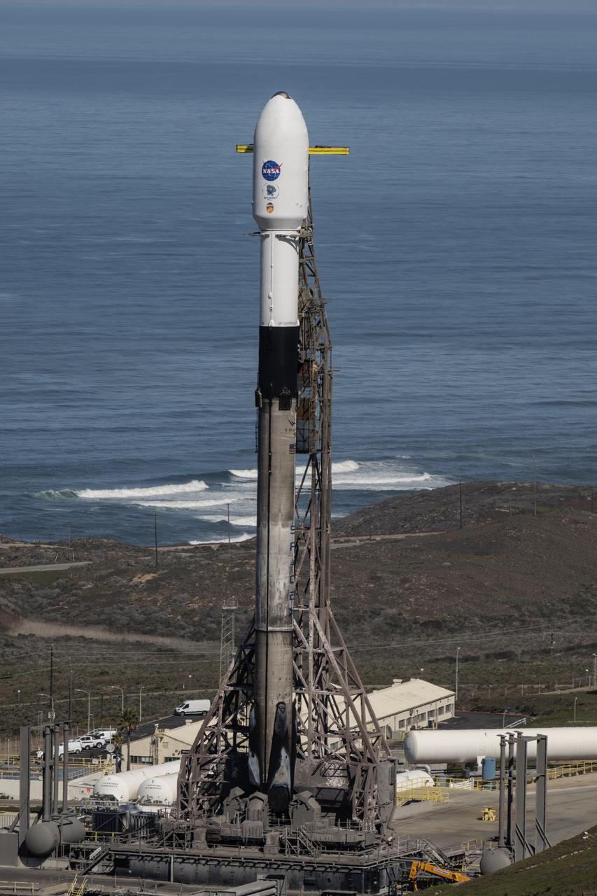 A SpaceX Falcon 9 rocket, carrying NASA’s SPHEREx (Spectro-Photometer for the History of the Universe, Epoch of Reionization and Ices Explorer) observatory and PUNCH (Polarimeter to Unify the Corona and Heliosphere) satellites, is vertical at Space Launch Complex 4 East from Vandenberg Space Force Base in California on Saturday, March 8,  2025. SPHEREx will use its telescope to provide an all-sky spectral survey, creating a 3D map of the entire sky to help scientists investigate the origins of our universe. PUNCH will study origins of the Sun’s outflow of material, or the solar wind, capturing continuous 3D images of the Sun’s corona and the solar wind’s journey into the solar system. 