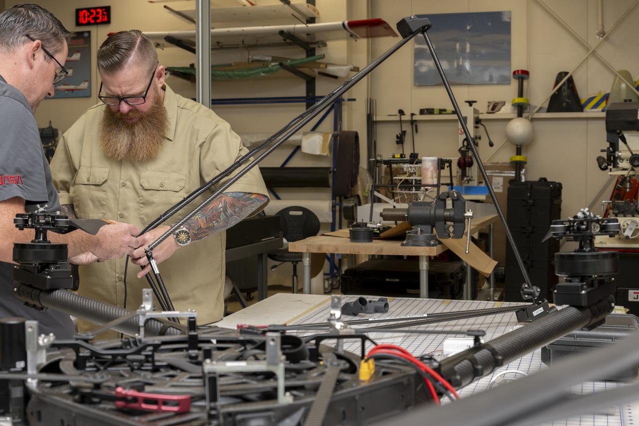 Justin Link, left, pilot for small uncrewed aircraft systems, and Justin Hall, chief pilot for small uncrewed aircraft systems, install weather instruments on NASA’s Alta X drone at the agency’s Armstrong Flight Research Center in Edwards, California. Members of the center’s NASA Armstrong Dale Reed Subscale Flight Research Laboratory used the Alta X to support the NASA’s FireSense project in March 2025 for a prescribed burn in Geneva State Forest, which is about 100 miles south of Montgomery, Alabama.