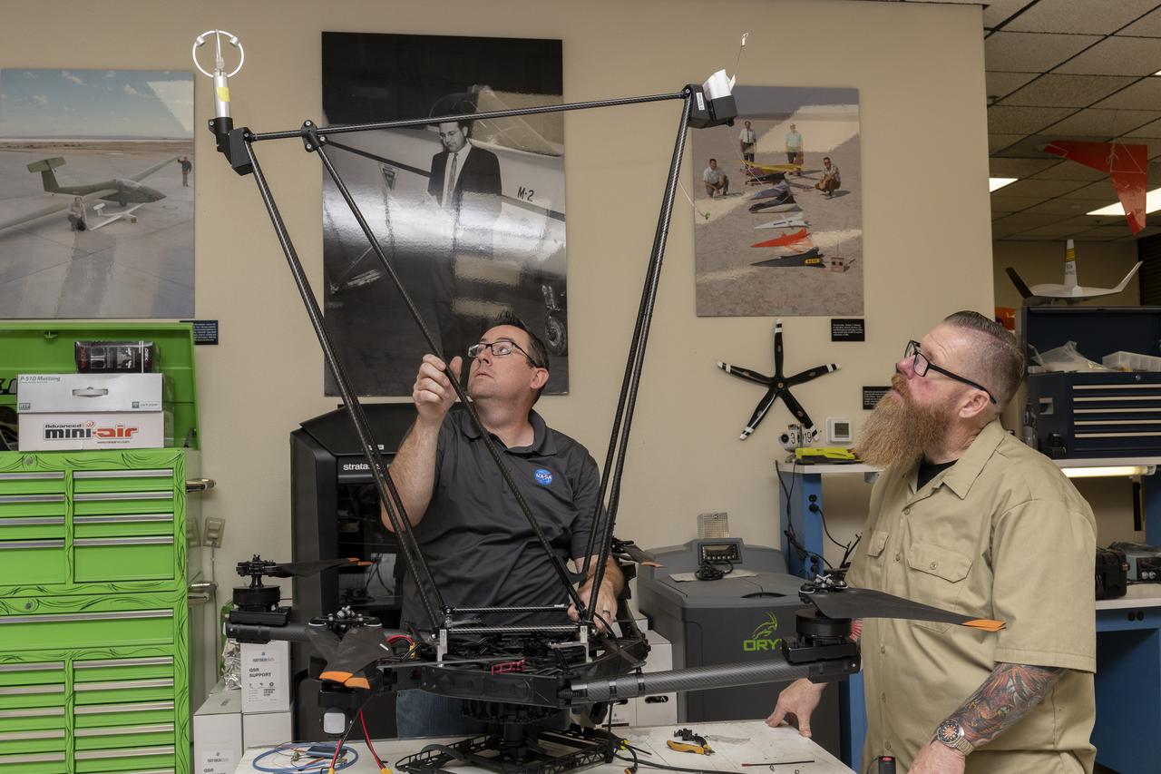 Justin Link, left, pilot for small uncrewed aircraft systems, and Justin Hall, chief pilot for small uncrewed aircraft systems, install weather instruments on NASA’s Alta X drone at the agency’s Armstrong Flight Research Center in Edwards, California. Members of the center’s Dale Reed Subscale Flight Research Laboratory used the Alta X to support the agency’s FireSense project in March 2025 for a prescribed burn in Geneva State Forest, which is about 100 miles south of Montgomery, Alabama.
