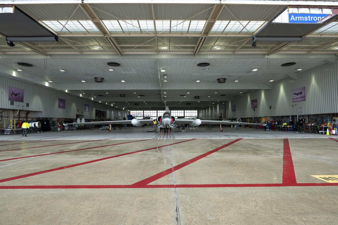 The ER-2 aircraft is parked in a hangar at NASA’s Armstrong Flight Research Center in Edwards, California, in March 2025. The plane is prepared for takeoff to support the airborne Lunar Spectral Irradiance, or air-LUSI, mission.