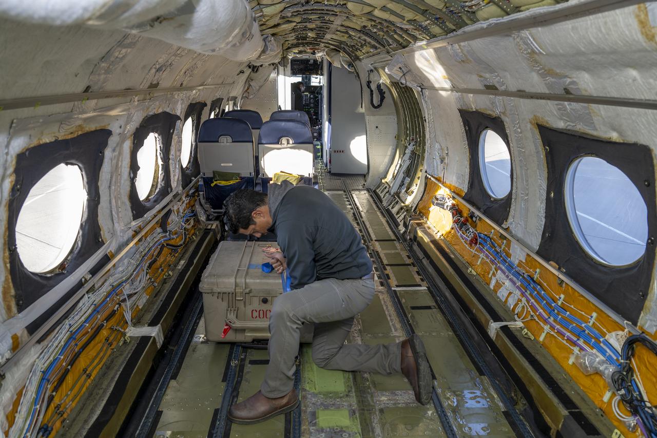 Jose “Manny” Rodriguez, technical engineer at NASA’s Armstrong Flight Research Center in Edwards, California, secures a trunk onboard the G-IV aircraft on March 18, 2025. As the newest member of NASA Armstrong’s airborne science fleet, the G-IV was sent to Avenger Aerospace Solutions in Cartersville, Georgia, for modifications that will optimize the G-IV’s performance as a research aircraft.