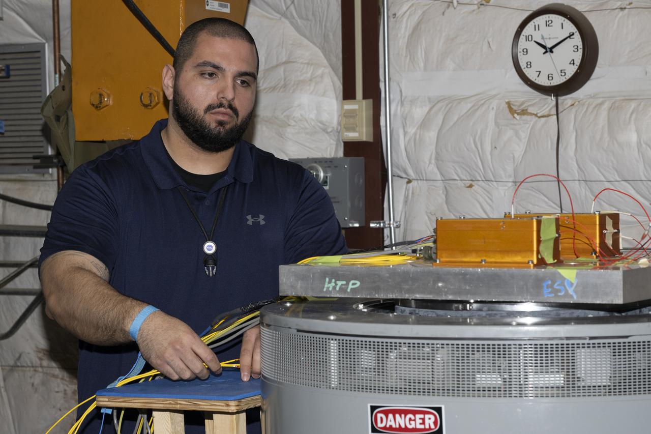 Jonathan Lopez prepares the hypersonic Fiber Optic Sensing System for vibration tests in the Environmental Laboratory at NASA’s Armstrong Flight Research Center in Edwards, California. Testing on a machine called a shaker proved that the system could withstand the severe vibration it will endure in hypersonic flight, or travel at five times the speed of sound.