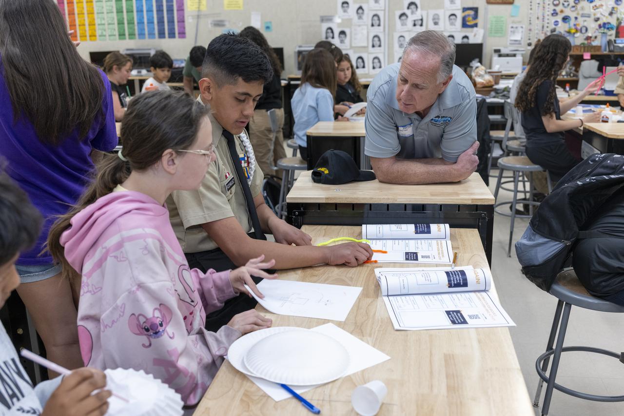 Gary Laier, center liaison for the Small Business Innovation Research/Small Business Technology Transfer (SBIR/STTR) program at NASA’s Armstrong Flight Research Center in Edwards, California, teaches students about aeronautics during Aero Fair at Tropico Middle School in Rosamond, California, on April 9, 2025.