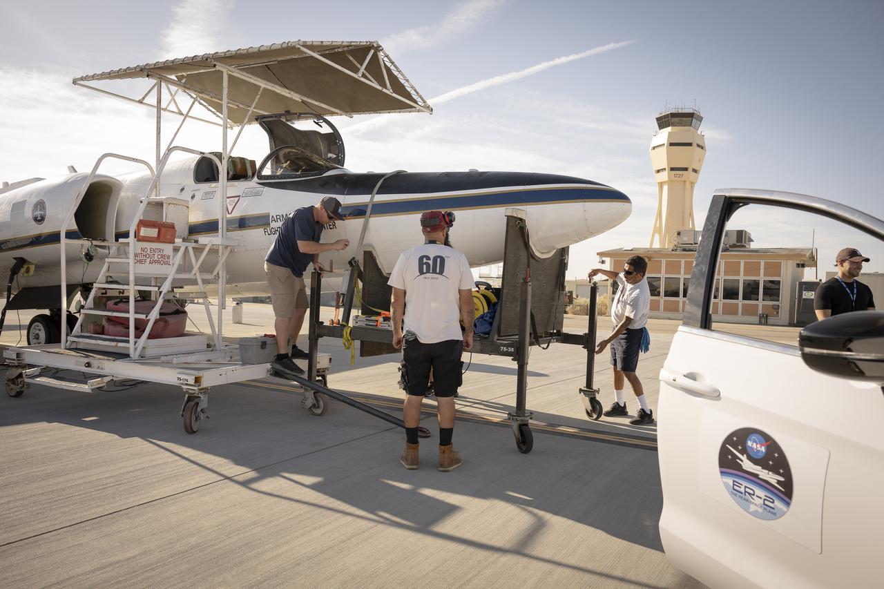Ground crew members make final preparations on NASA Armstrong Flight Research Center’s ER-2 aircraft at Edwards, California, on Thursday, Aug. 21, 2025, ahead of a high-altitude mission for the Geological Earth Mapping Experiment (GEMx). The pilot will soon board the aircraft, which can fly at altitudes up to 70,000 feet.