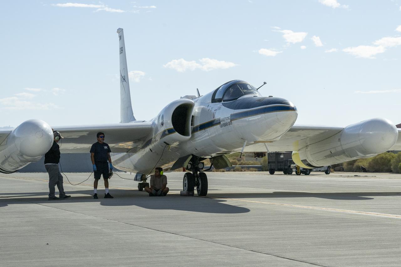 Crew members prepare NASA Armstrong Flight Research Center’s ER-2 aircraft for flight at Edwards, California, on Tuesday, Sept. 23, 2025, in support of the Geological Earth Mapping Experiment (GEMx). The high-altitude science aircraft operates between 20,000 and 70,000 feet. For this mission, pilots flew at approximately 65,000 feet, requiring them to wear specially designed pressure suits.